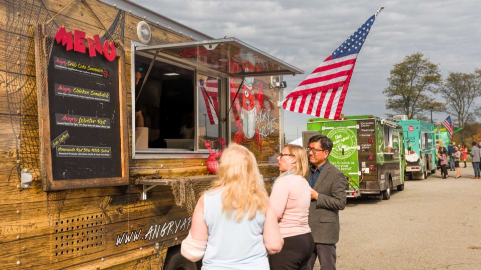 People ordering from food truck